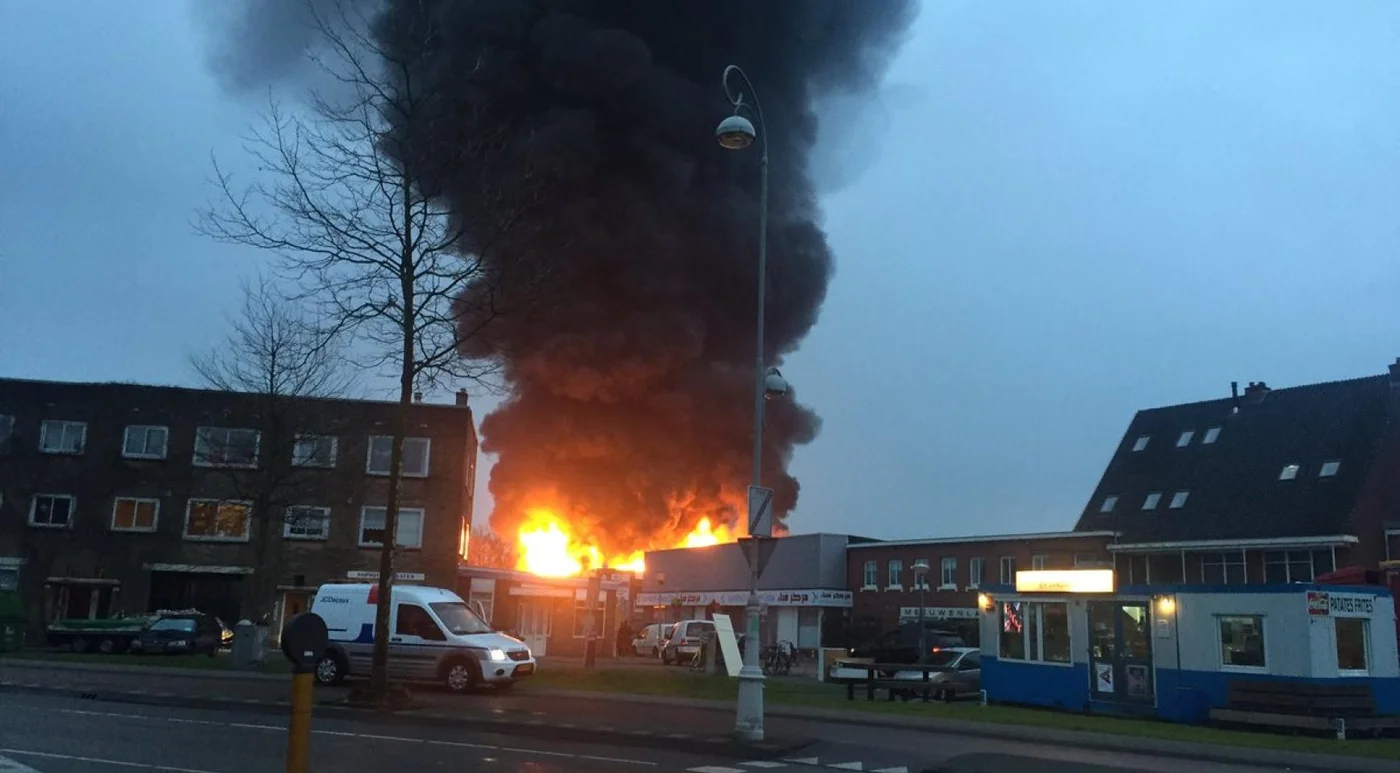 Flames and smoke rising from the fire on Schaafstraat in Amsterdam-Noord on 7 March 2017